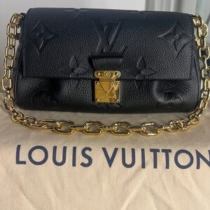 Authentic, New Louis Vuitton Favorite Monogram Empreinte Black Leather Crossbody